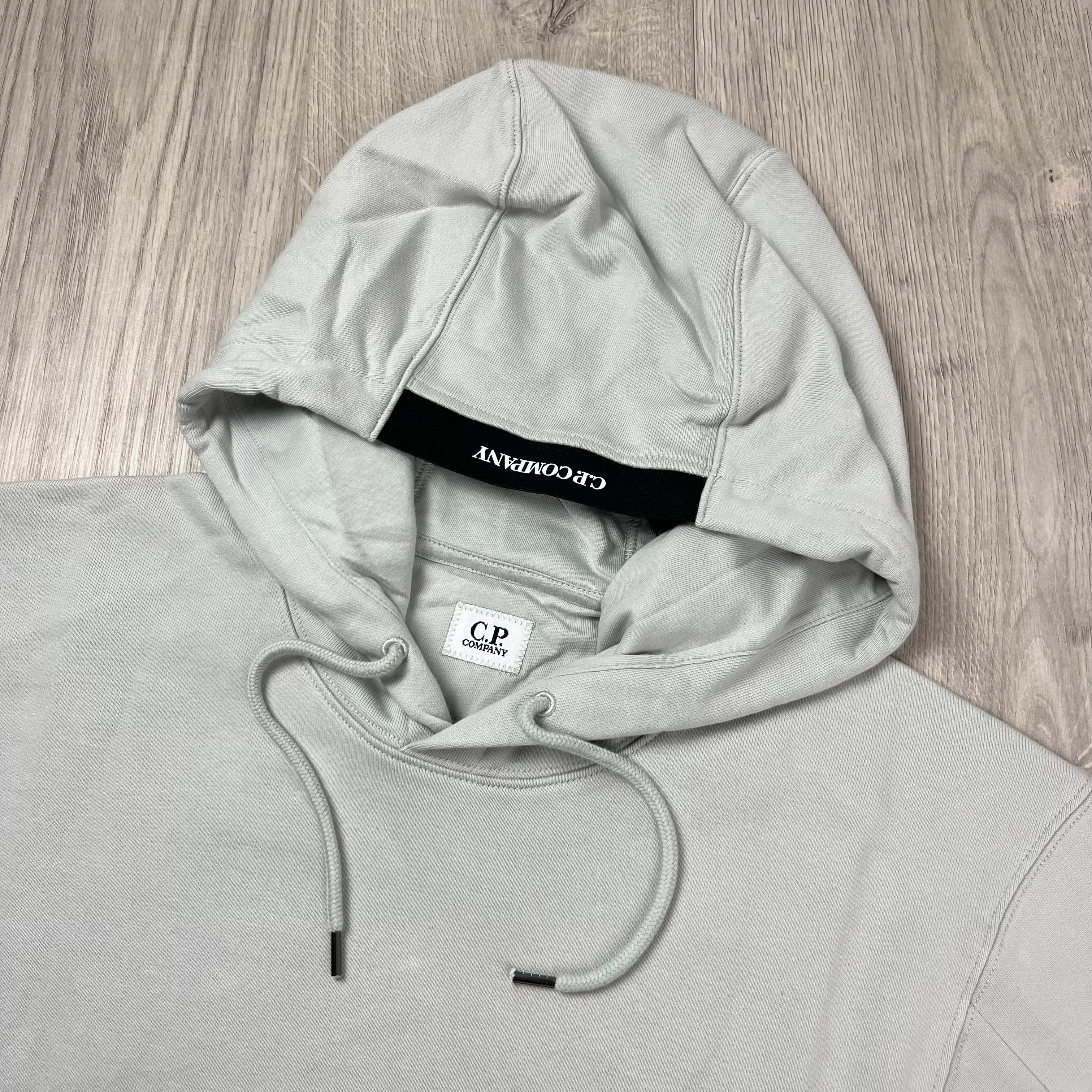CP Company Diagonal Raised Fleece Hoodie in Blue Fox. On sale at Open Attire.