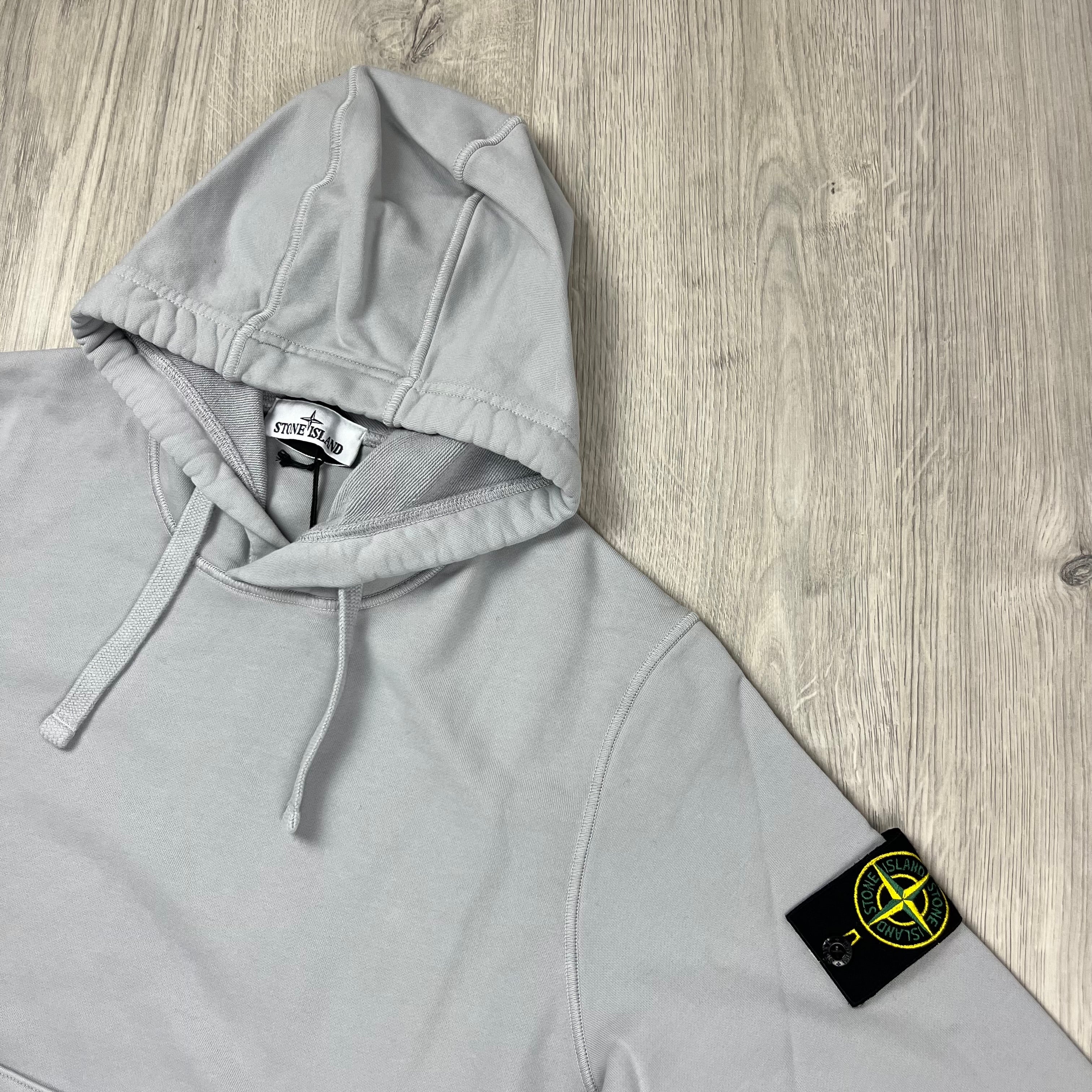 Stone Island Dyed Cotton Hoodie in Pearl Grey. On sale at Open Attire.