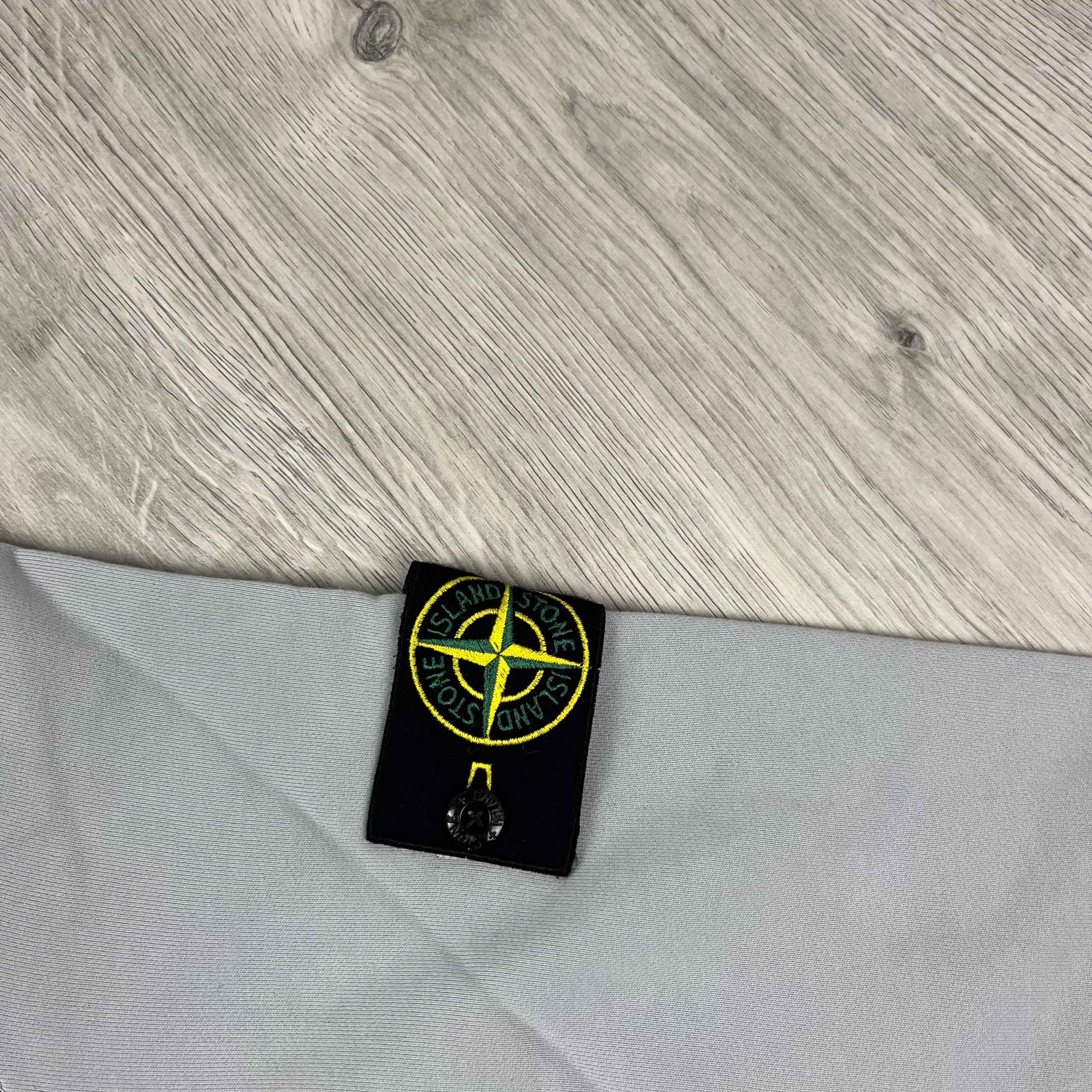 Stone Island Dyed Cotton Hoodie in Pearl Grey. On sale at Open Attire.