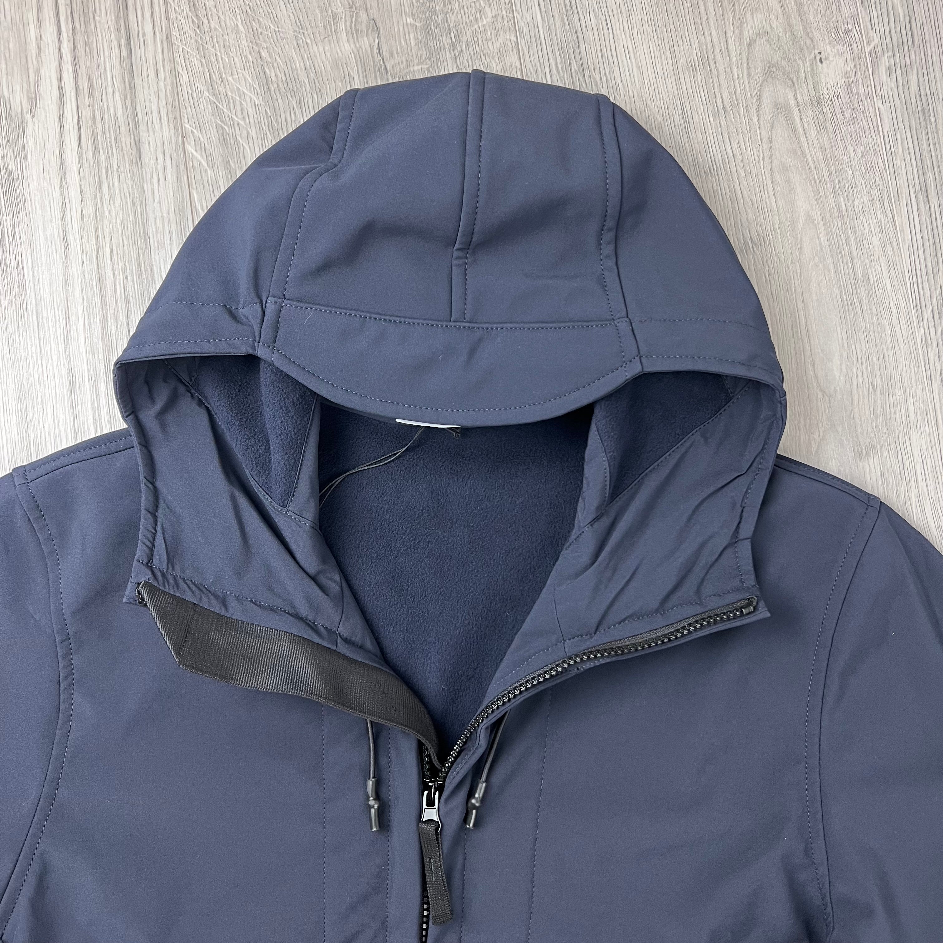 A close up view of the hood on a Stone Island Soft Shell-R_e.dye® Jacket in Navy Blue.
