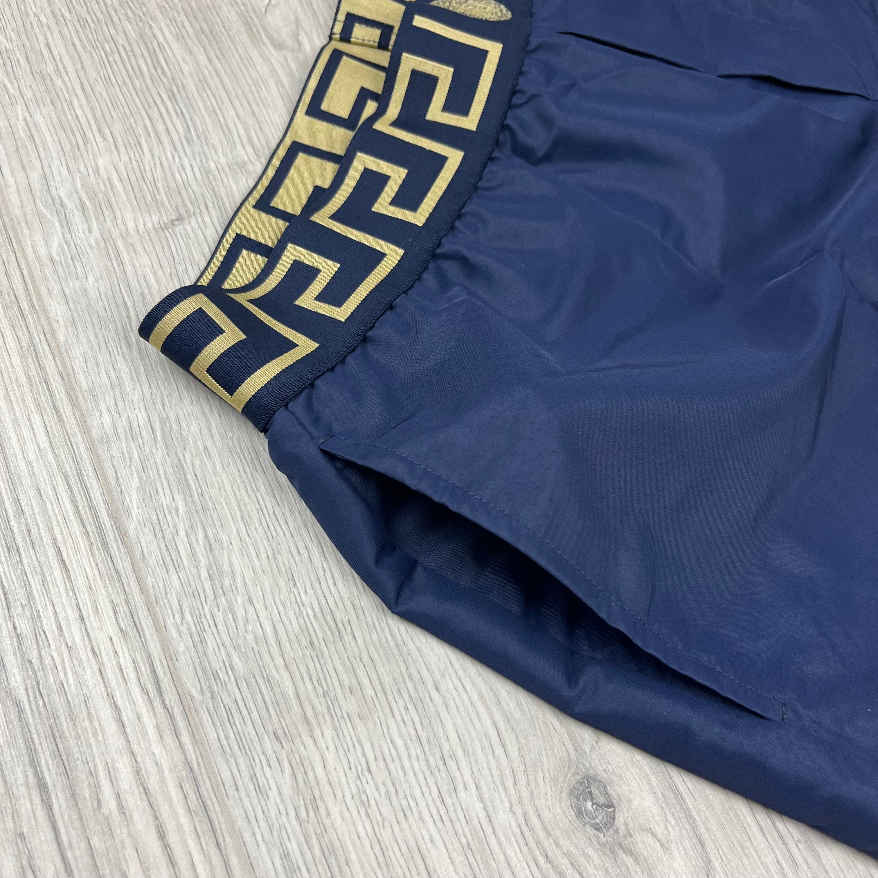 Versace Greca Swim Shorts in Navy Blue. On sale at Open Attire