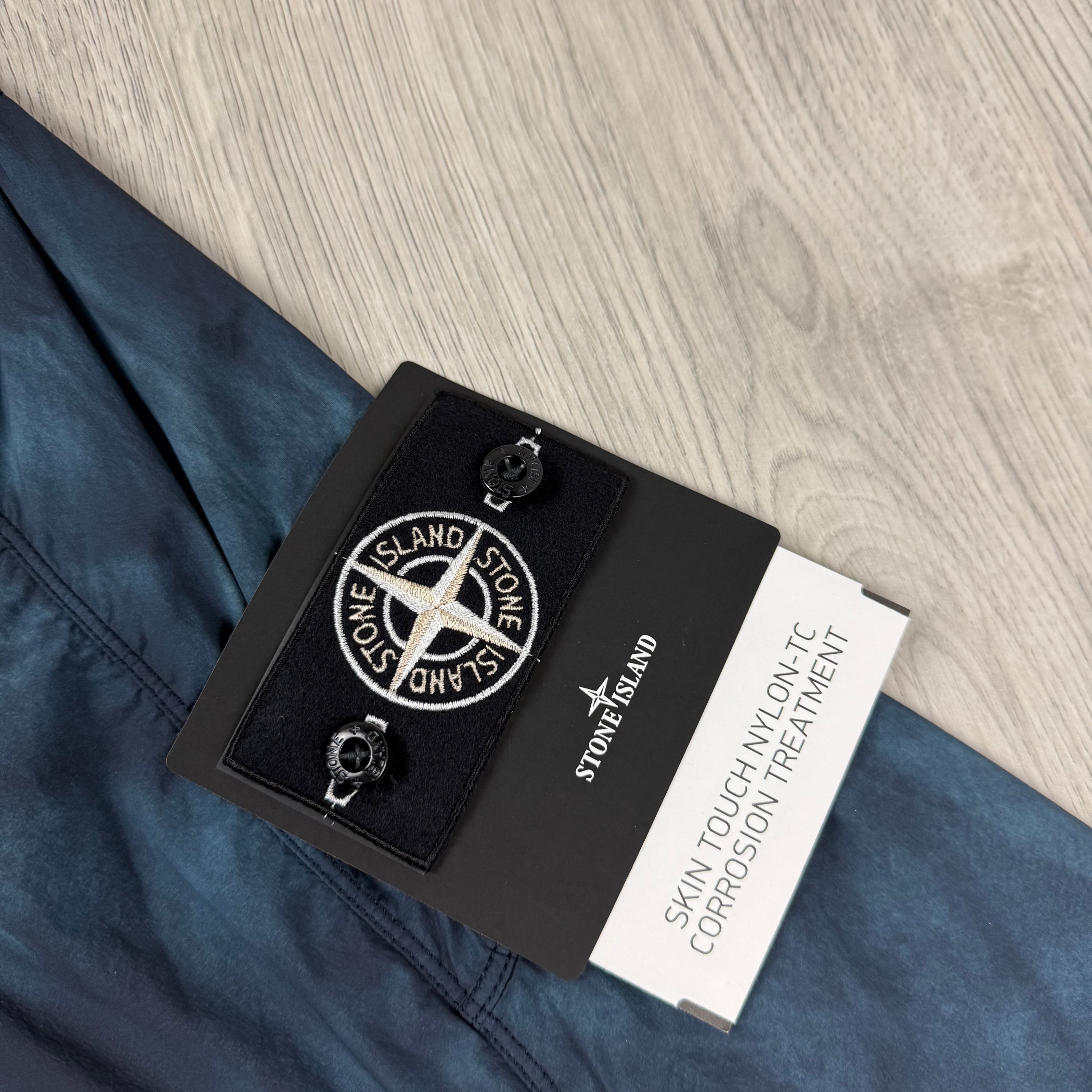 Men's Stone Island Skin Touch Nylon-TC Hooded Jacket in Black. On sale at Open Attire.