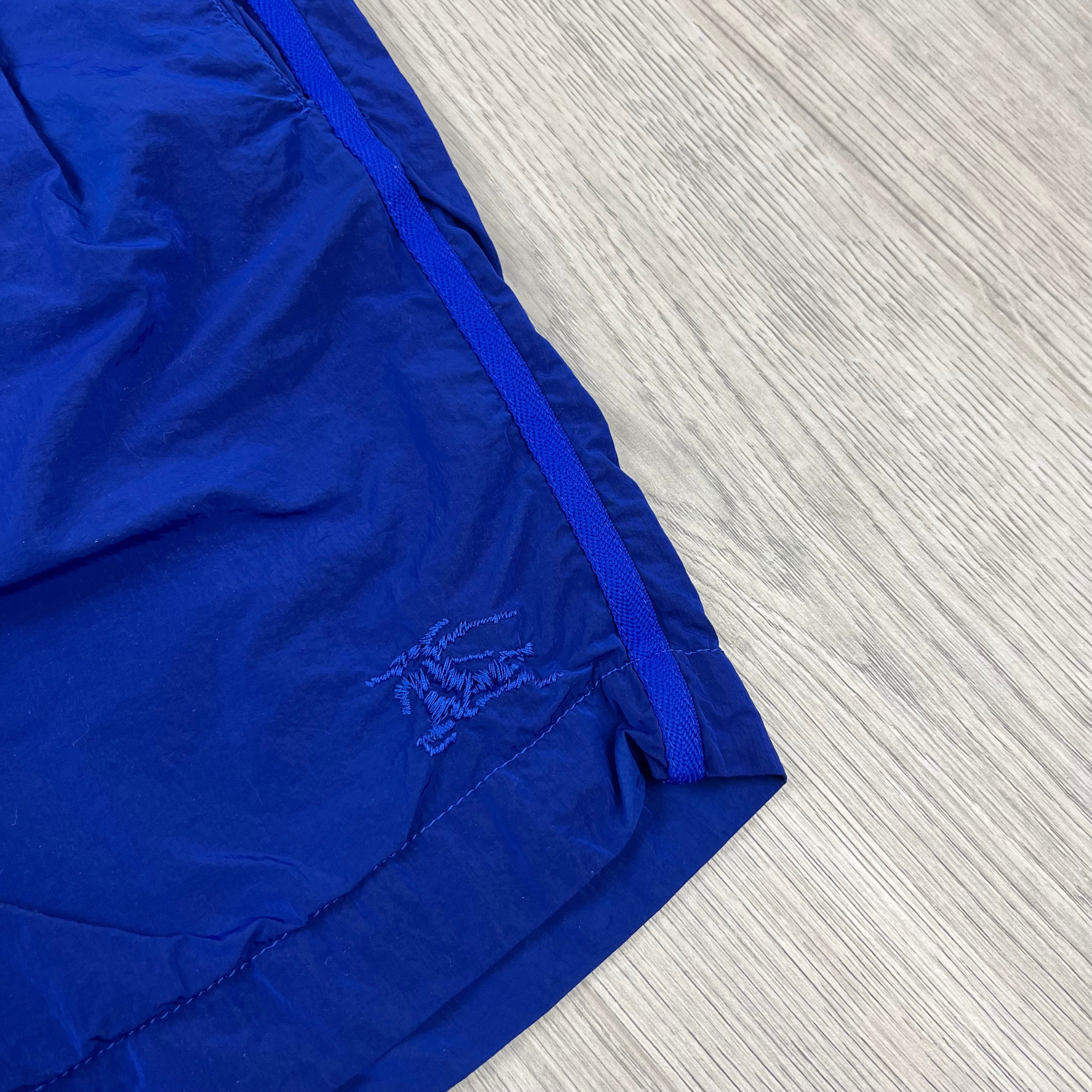 Burberry Nylon EKD Swim Shorts in Blue. On sale at Open Attire.