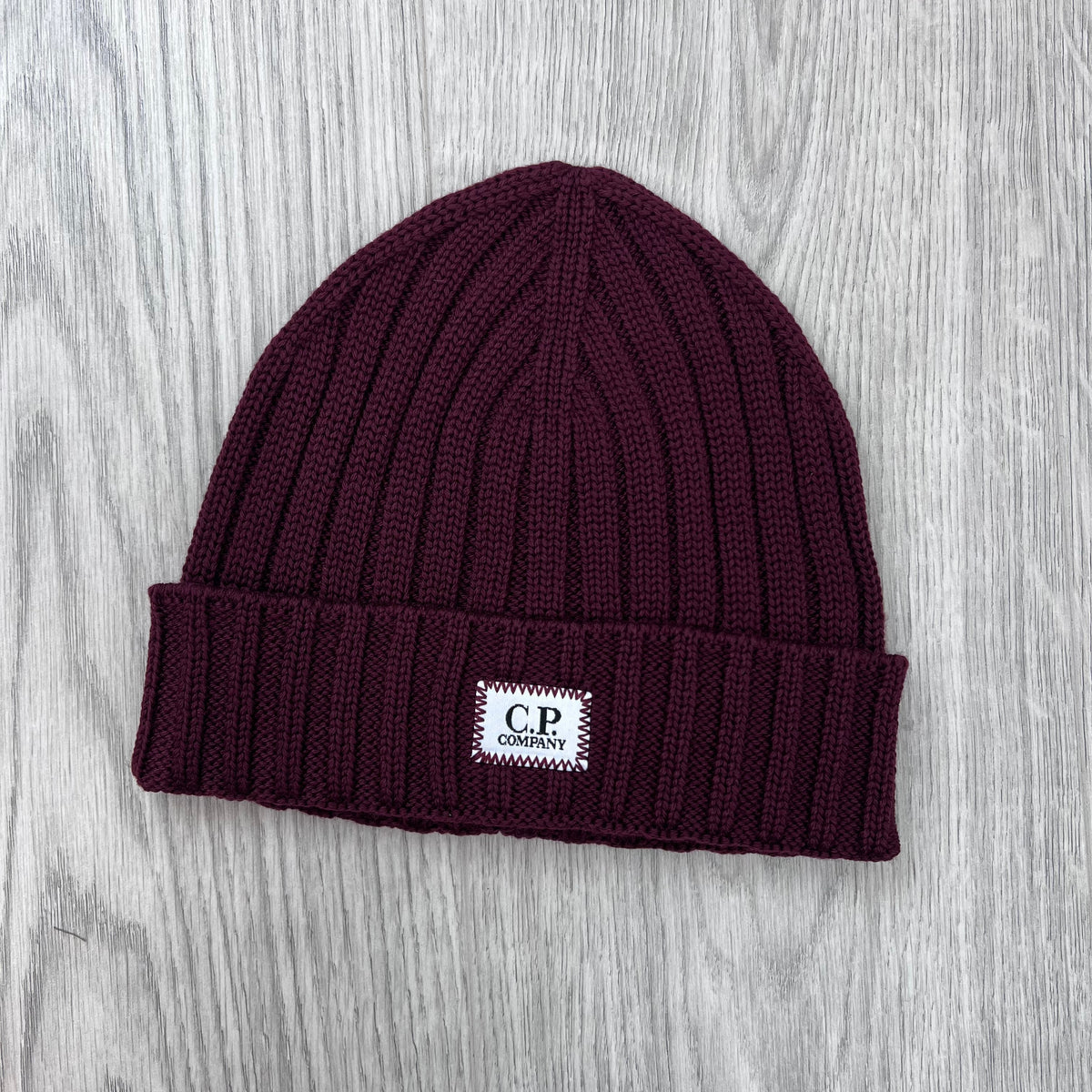 Front view of the CP Company Merino Wool Patch Beanie in Andorra.
