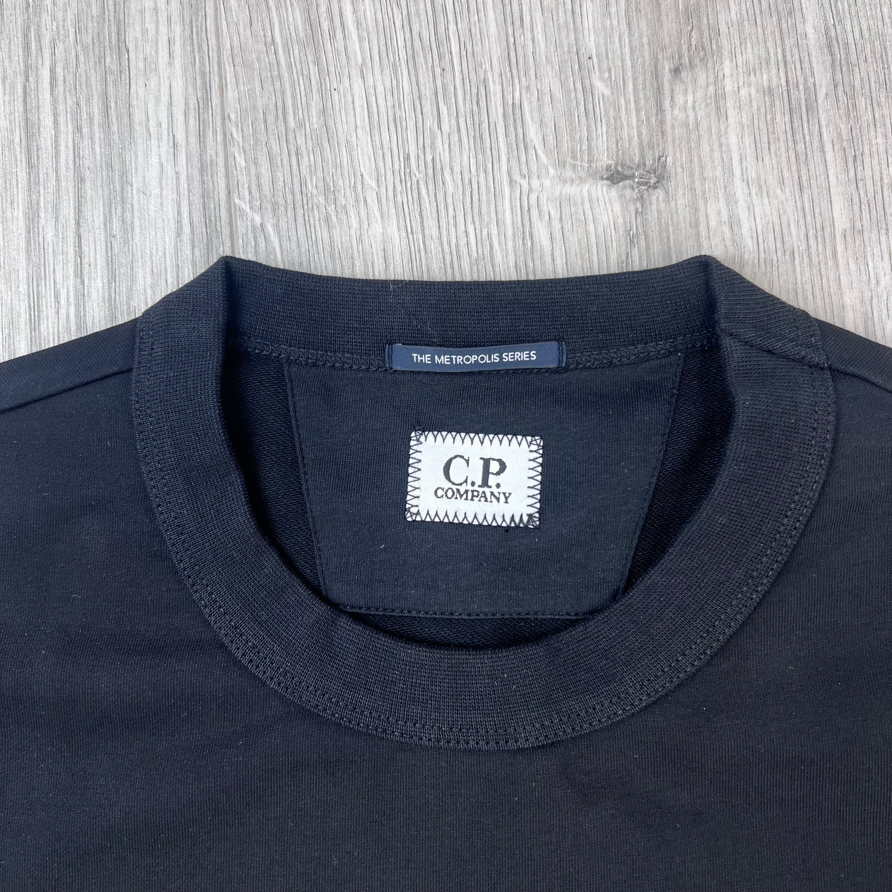 A close view of the crewneck collar on a CP Company Metropolis Series Stretch Fleece Sweatshirt with labels centred on the inside. 