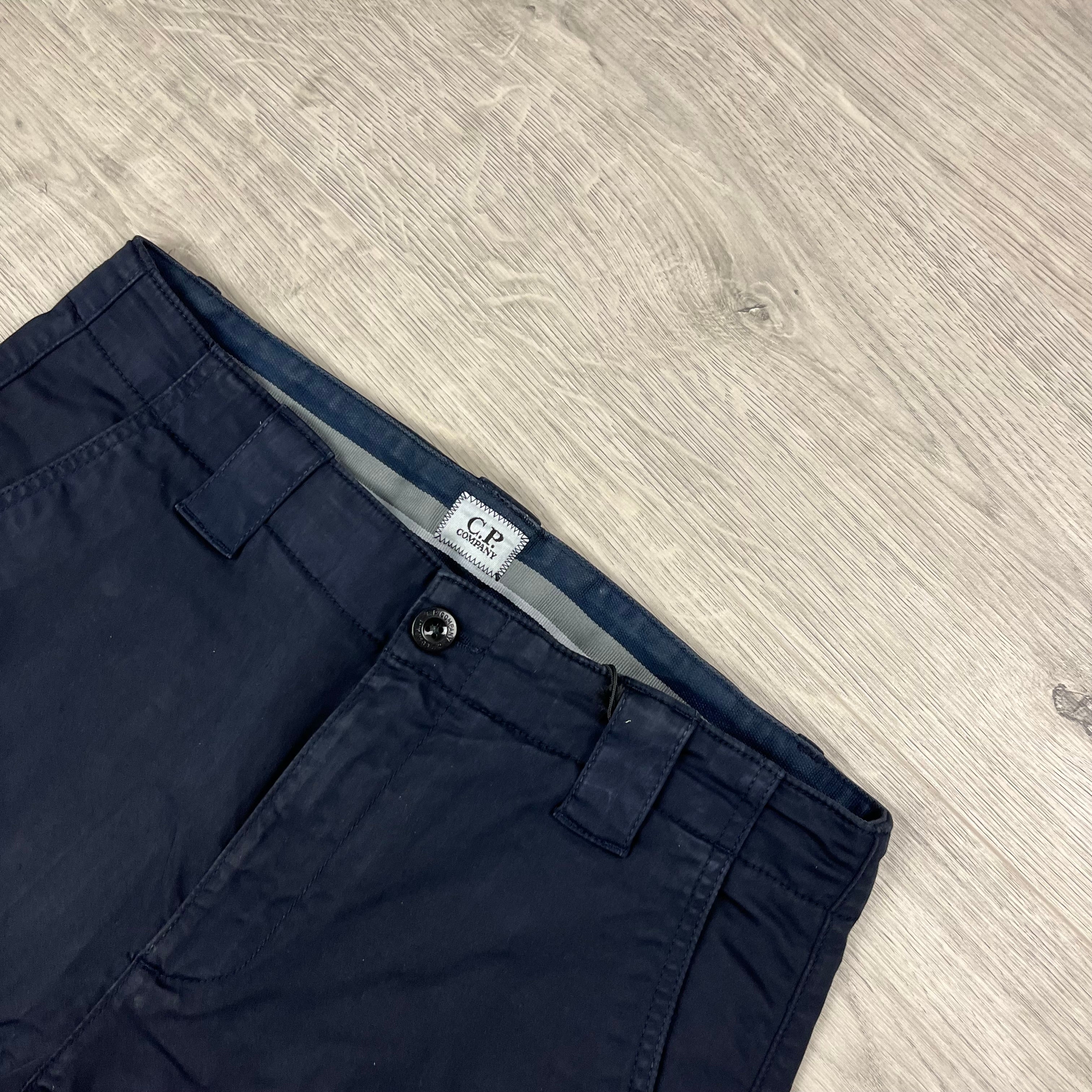 CP Company Stretch Sateen Cargo Shorts in Total Eclipse. On sale at Open Attire.