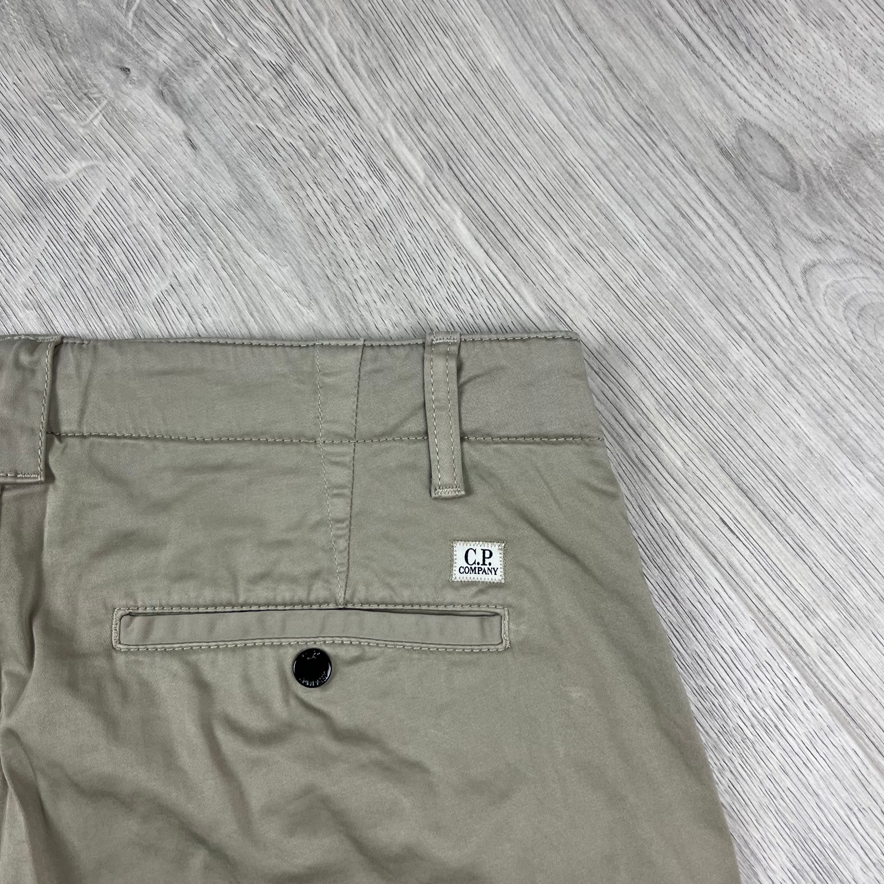 CP Company Stretch Sateen Cargo Shorts in Vintage Khaki. On sale at Open Attire.