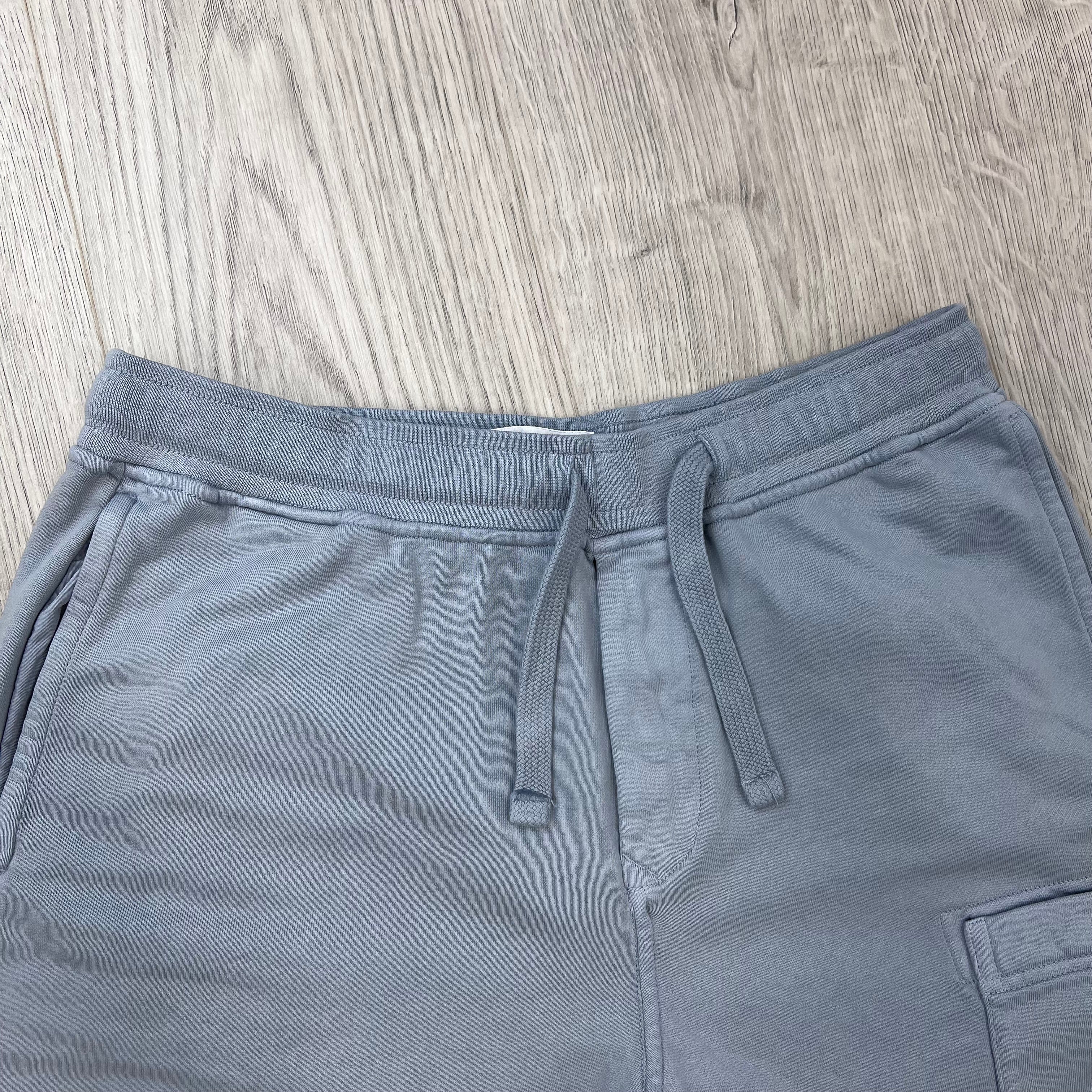 A close up view of the drawstring and waistband on the Stone Island Jersey Shorts in Ash Grey. 