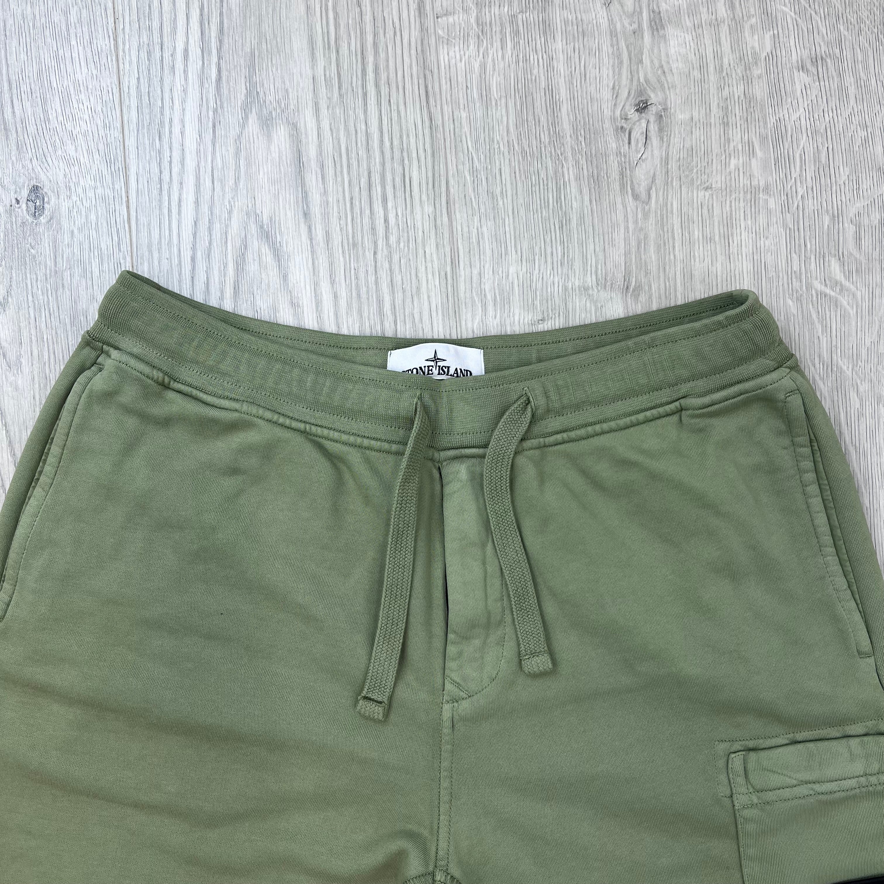 Front view of the waistband and drawstring on the Stone Island Jersey Shorts in Laurel Green. 