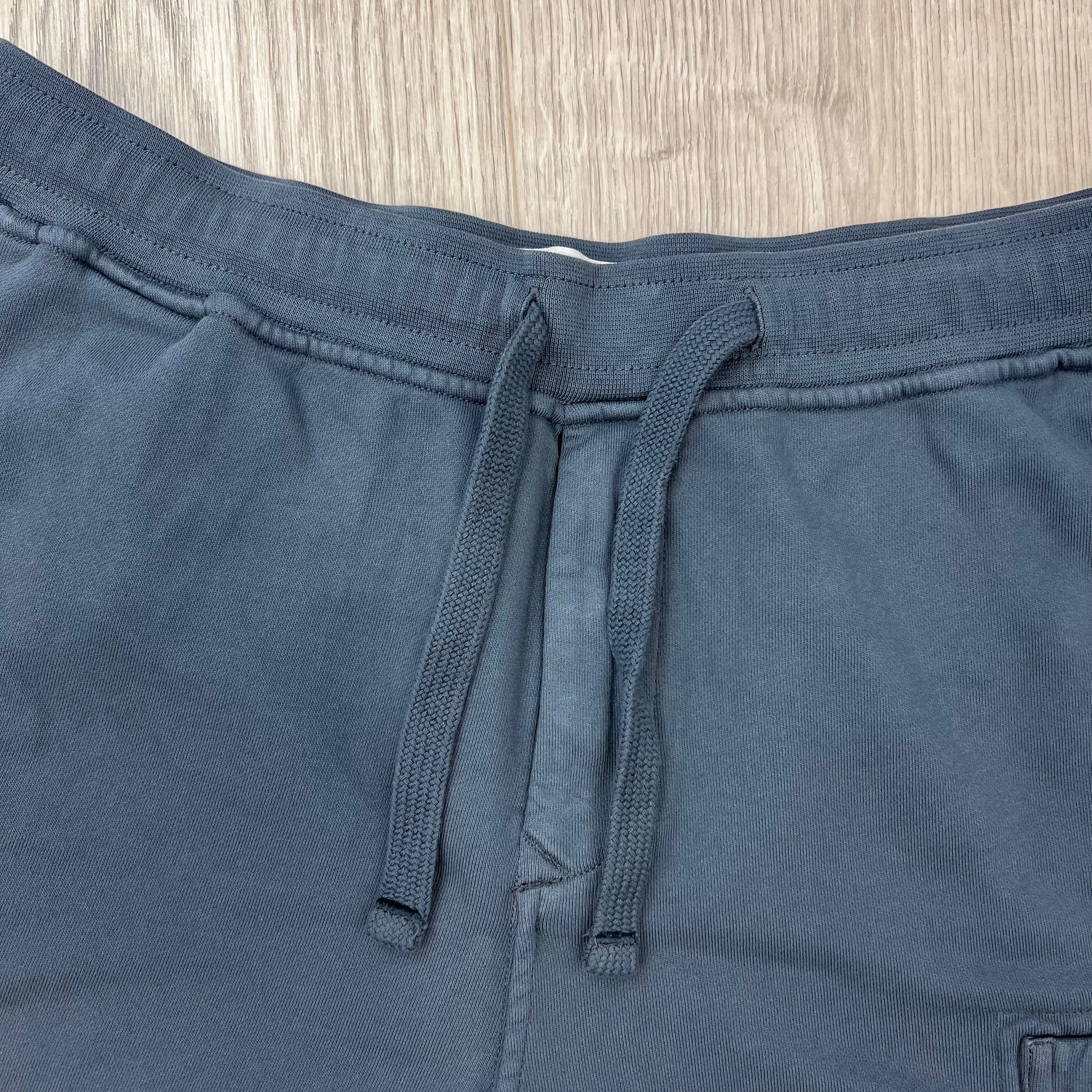 A close up view of the drawstring and waistband on the Stone Island Jersey Shorts in Slate Blue. 