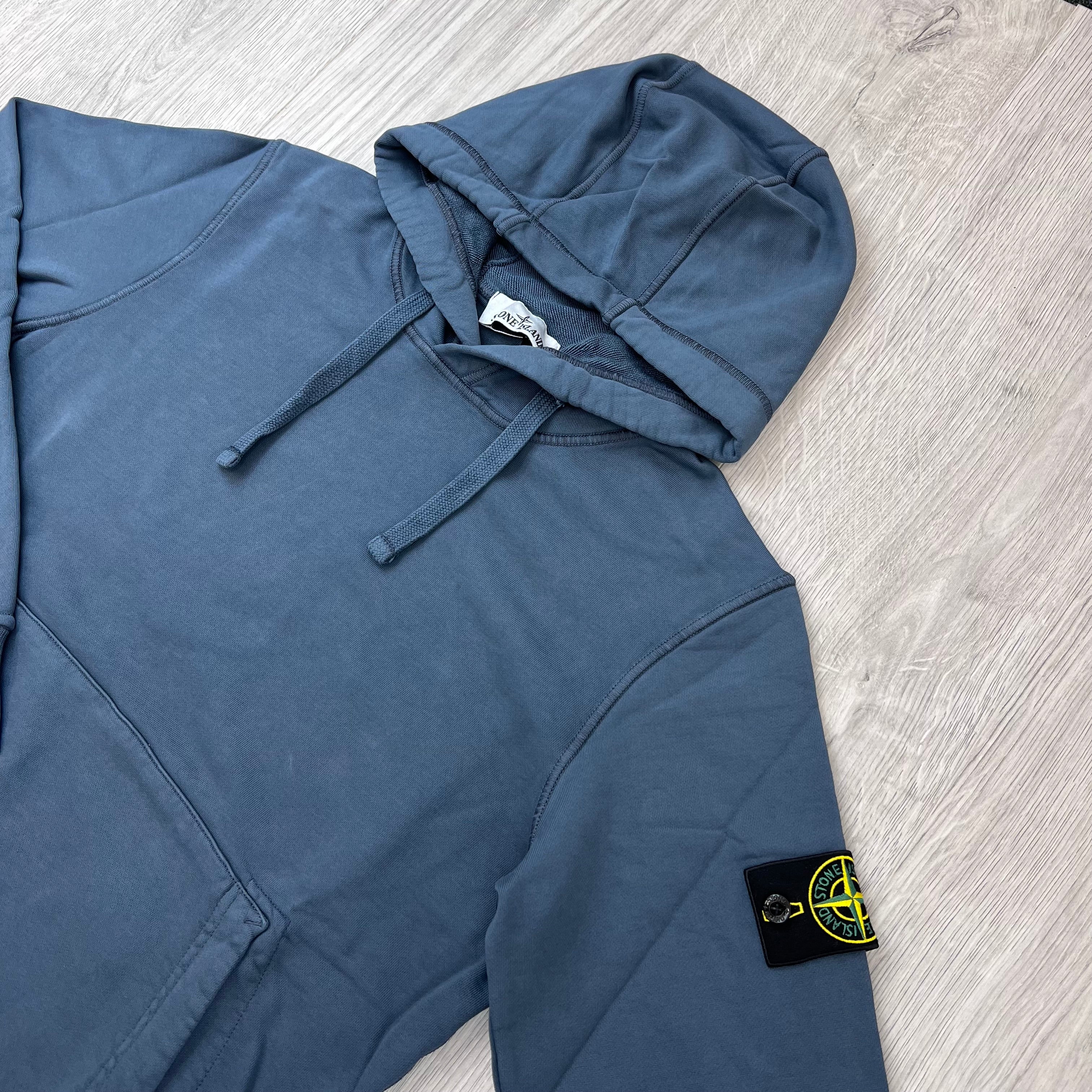 Angled view of a Stone Island Pullover Hoodie in Slate Grey. 