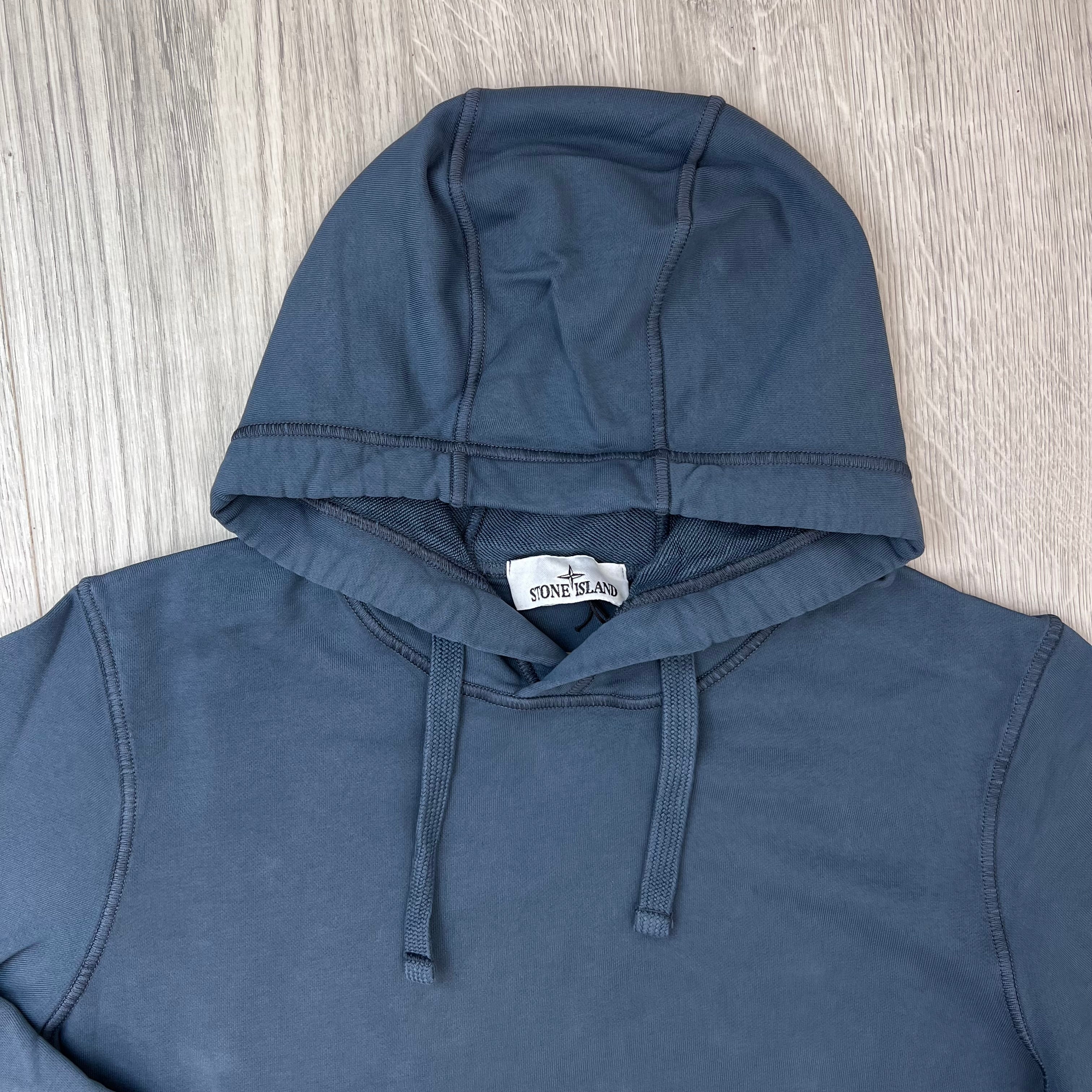 A close up view of the hood and drawstring on a Stone Island Pullover Hoodie in Slate Blue. 