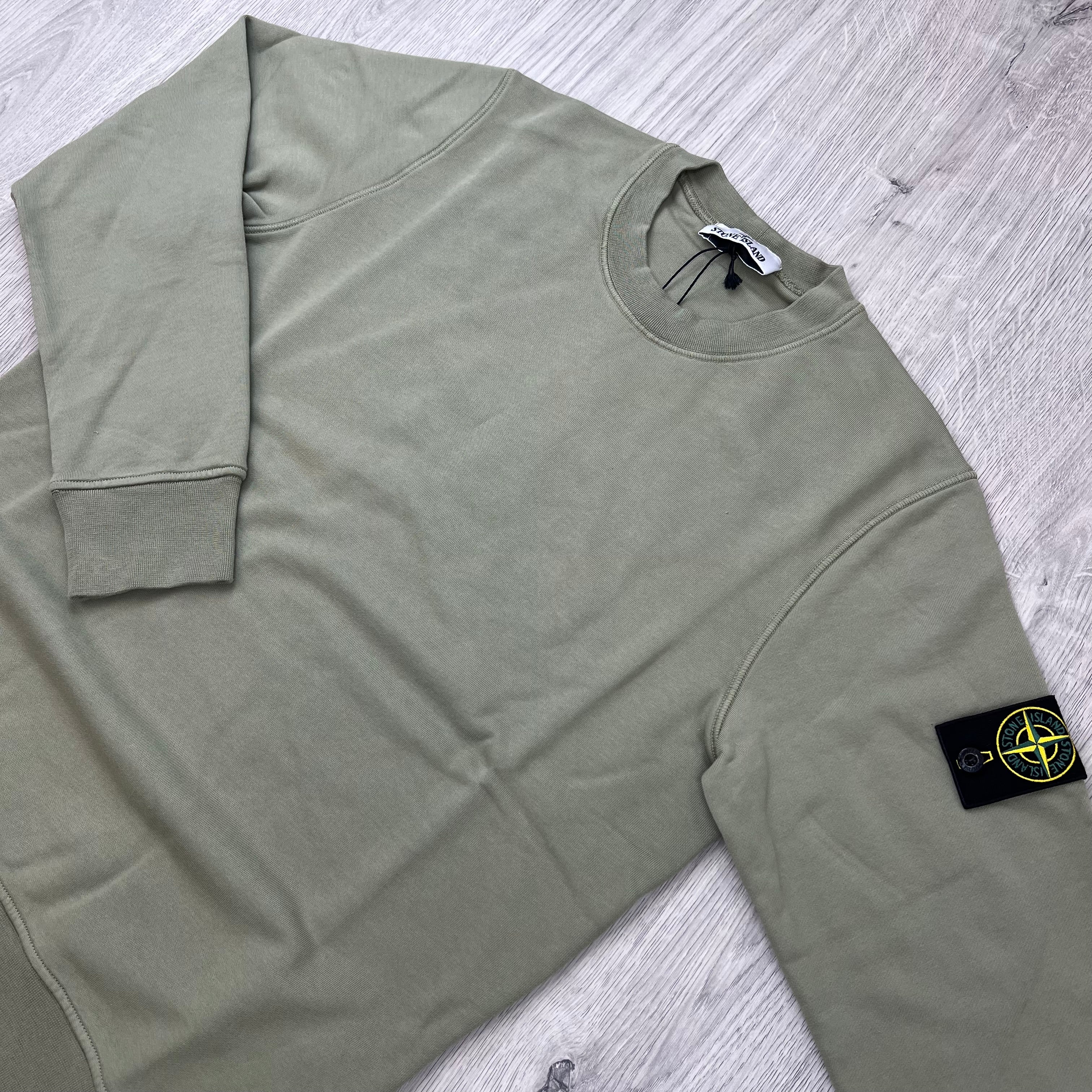 Angled view of the Stone Island Crewneck Sweatshirt in Laurel Green.
